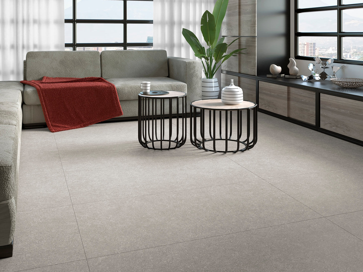 Moderne stueområde med matte møbler og Belgravia Pearl betonfliser