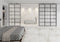 Calacatta marmorfliser på vægge og gulve i soveværelse med badekar i baggrunden