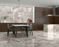 Køkkenområde med bord, komfur og andre møbler med Iceland Topaz marmor fliser på vægge og gulv